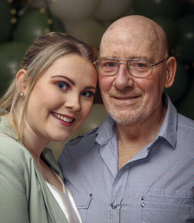 A patient testimonial picture of two people