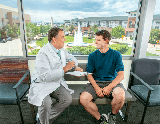 Dr Peter G. Hovland meeting with a patient